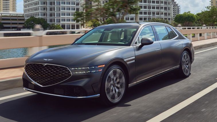 2024 Genesis G90 driving over a bridge.