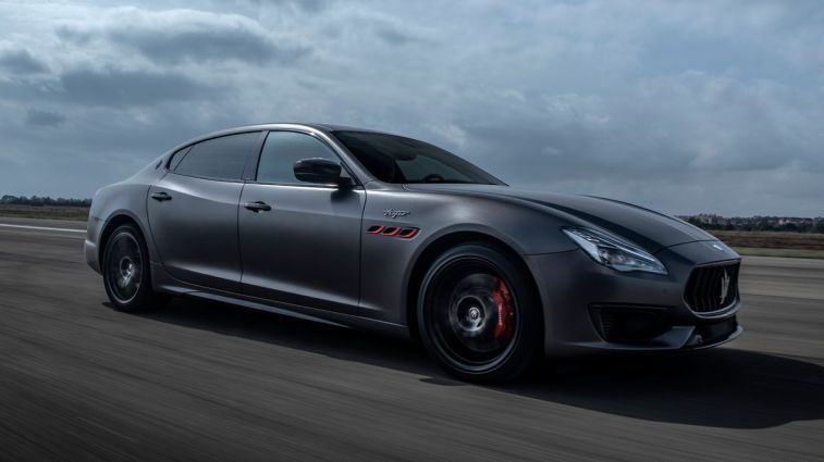 2024 Maserati Quattroporte Trofeo driving on a road.