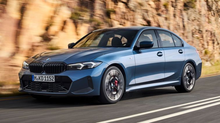 2025 BMW 3 Series driving on a mountain road.