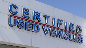 Certified used car sign at a dealership.