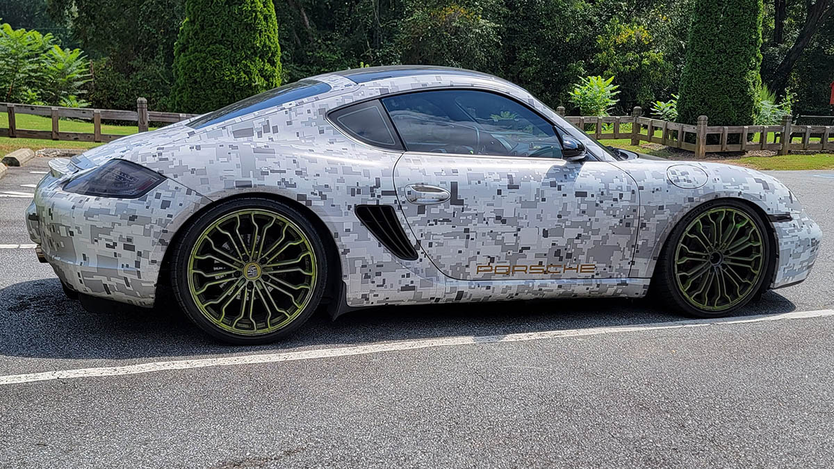 Porsche GT3 with geometric camo car wrap.