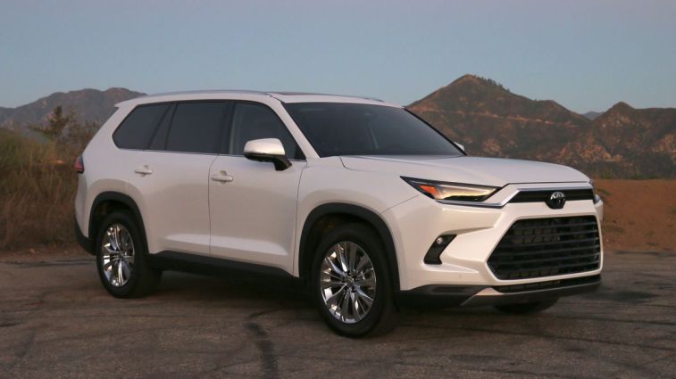 2024 Toyota Grand Highlander in white at sunrise on GMR.