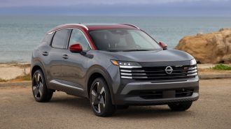 2025 Nissan Kicks SR parked near the beach.