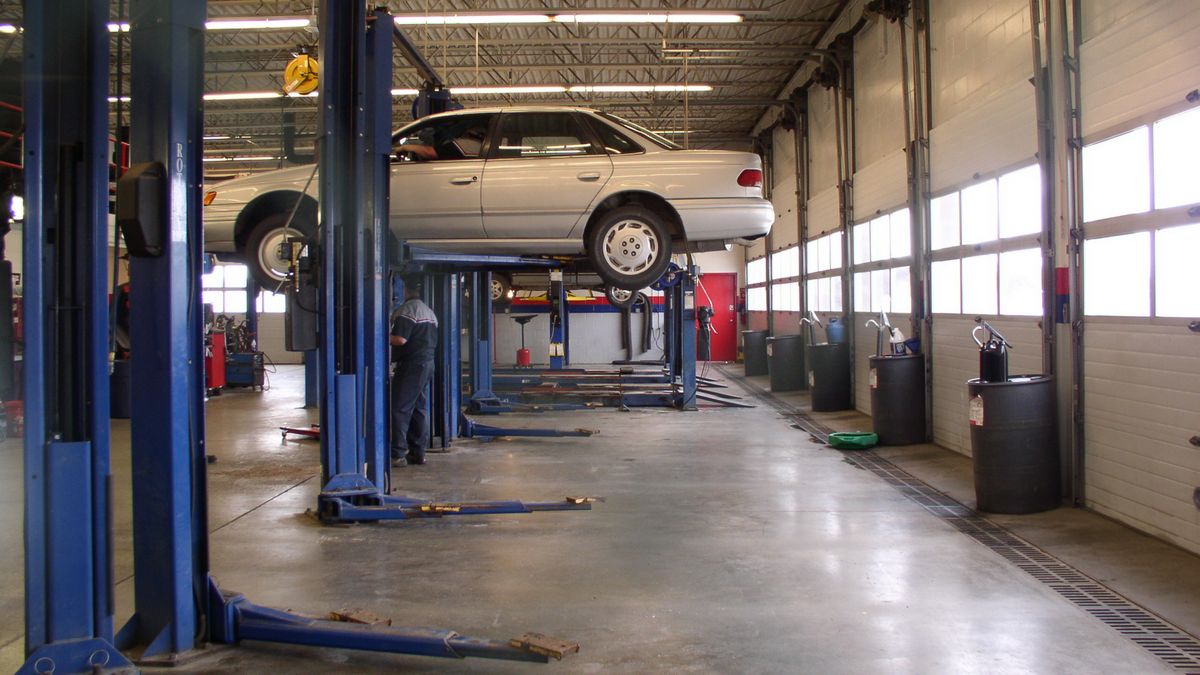 2-post car lifts in a repair shop.
