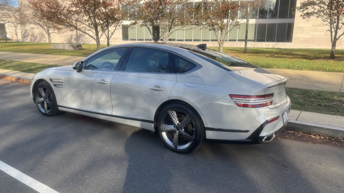 The 2025 Genesis G80 seen from a rear quarter angle