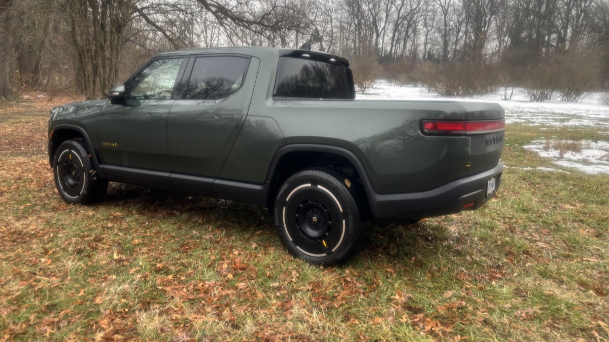 The 2025 Rivian R1T seen from a rear quarter angle