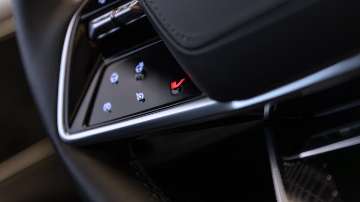 The steering wheel of the 2026 Cadillac Lyriq-V, with its V-mode button