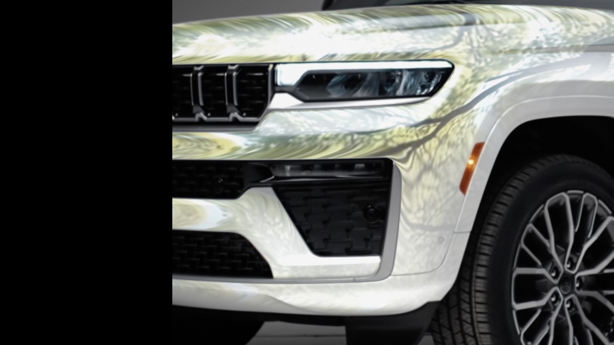 A teaser photo showing the front end of the 2026 Jeep Grand Cherokee