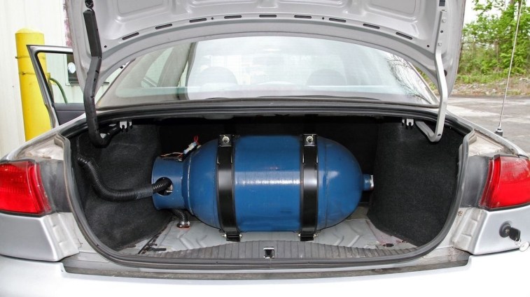 Natural gas cylinder mounted in the trunk of a bifuel car.